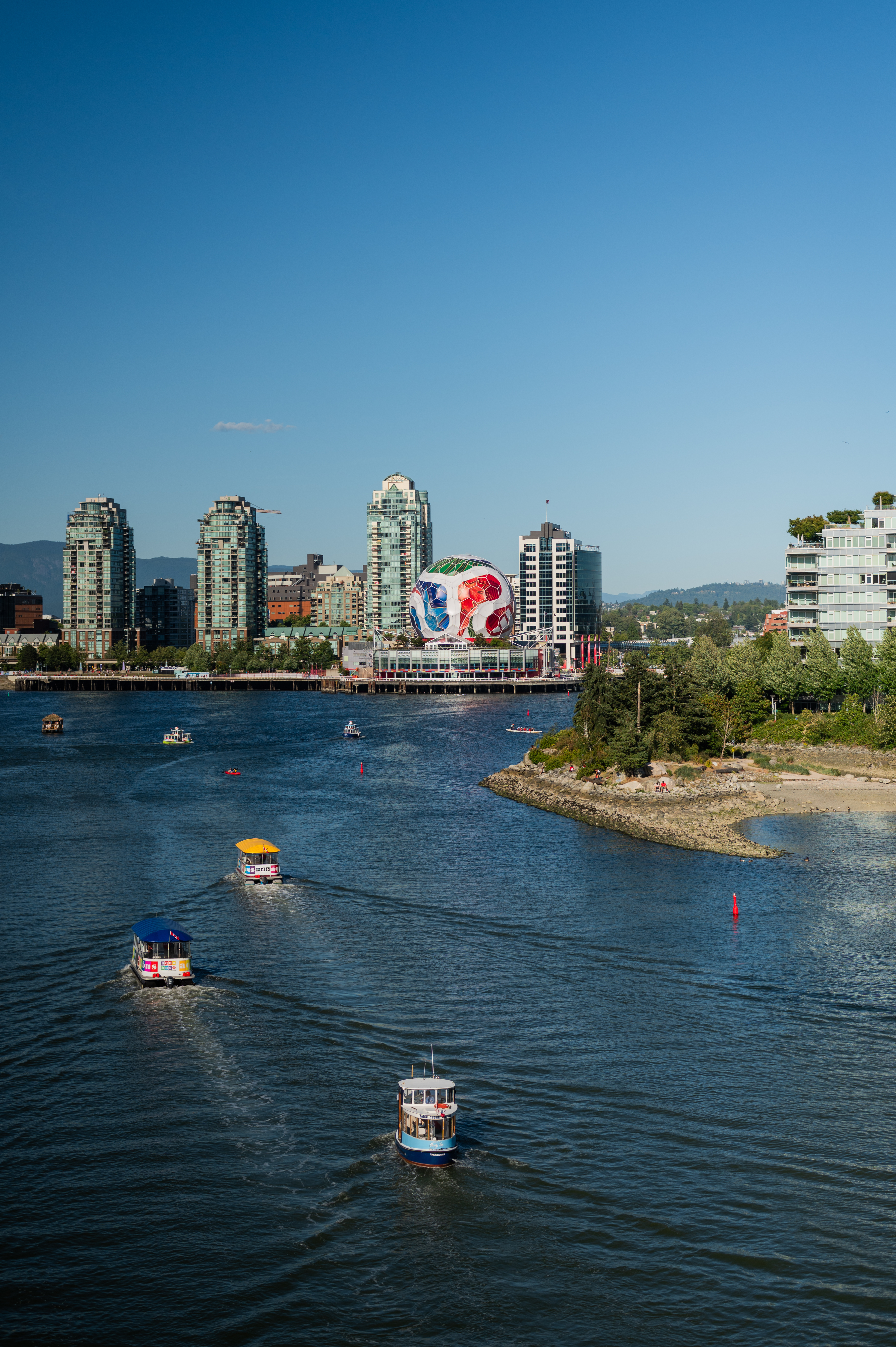 Vancouver cityscape with a large colorful World Cup football structure by the waterfront
